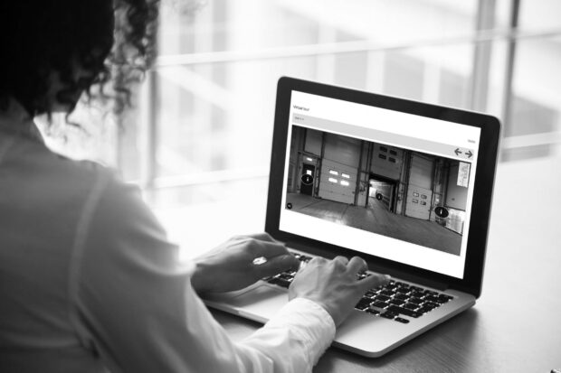 African businesswoman analyzing project statistics on laptop screen, close up